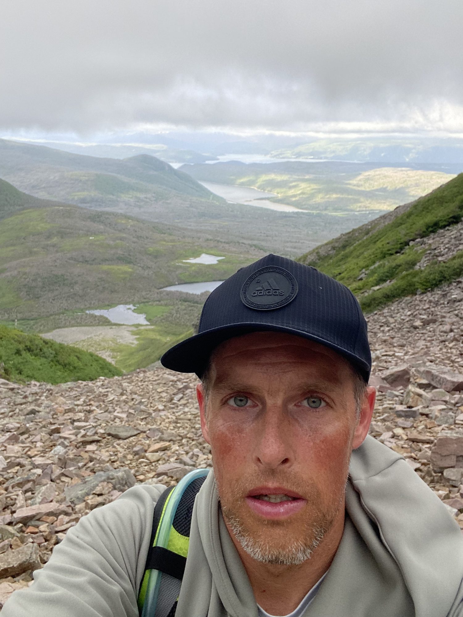 Hiker near the summit of Gros Morne Mountain